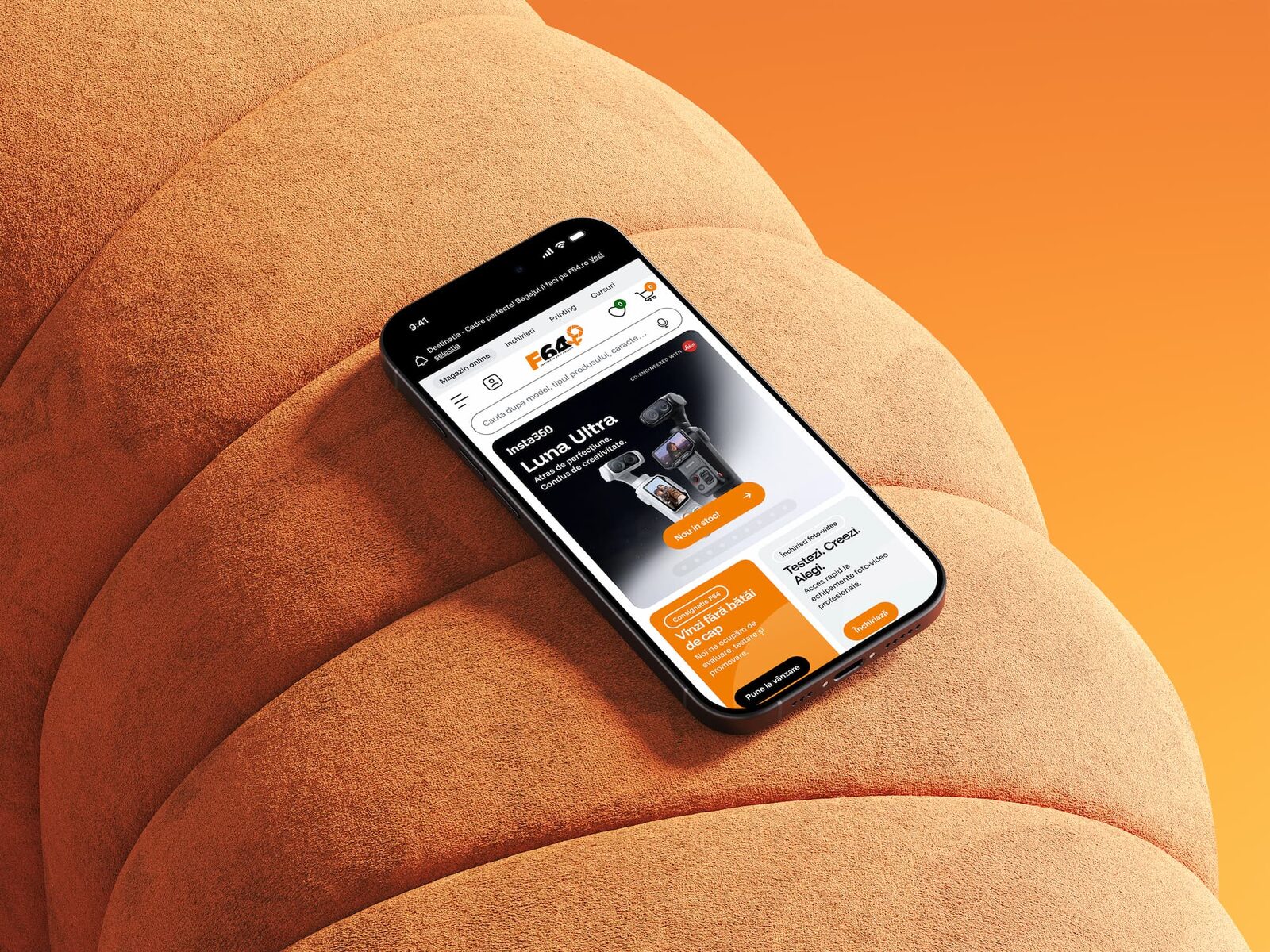 The F64 mobile storefront on a phone, on an orange couch